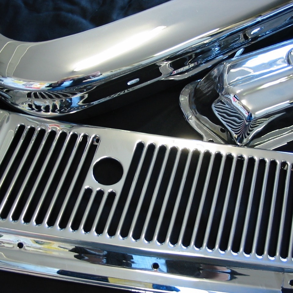 Chrome-plated automotive parts on a plating rack